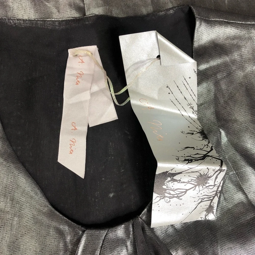 A. Nita Charcoal Metallic Top